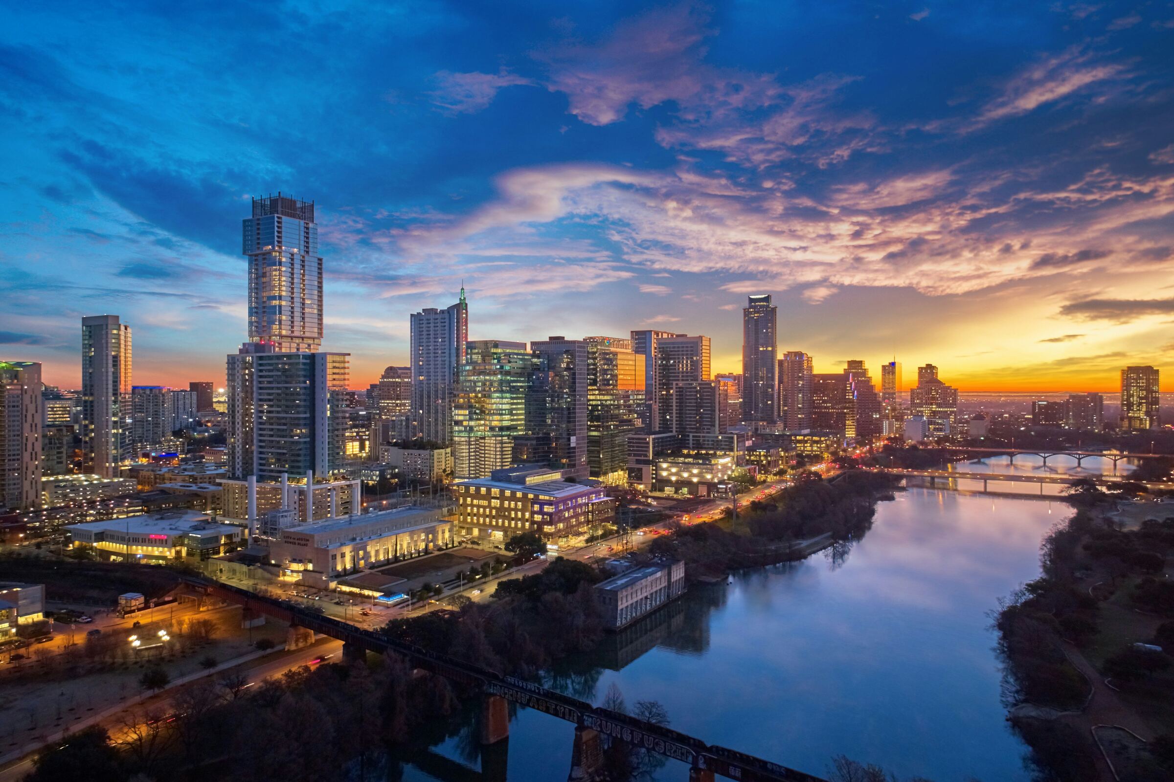 Austin, Texas skyline at sunset along Lady Bird Lake