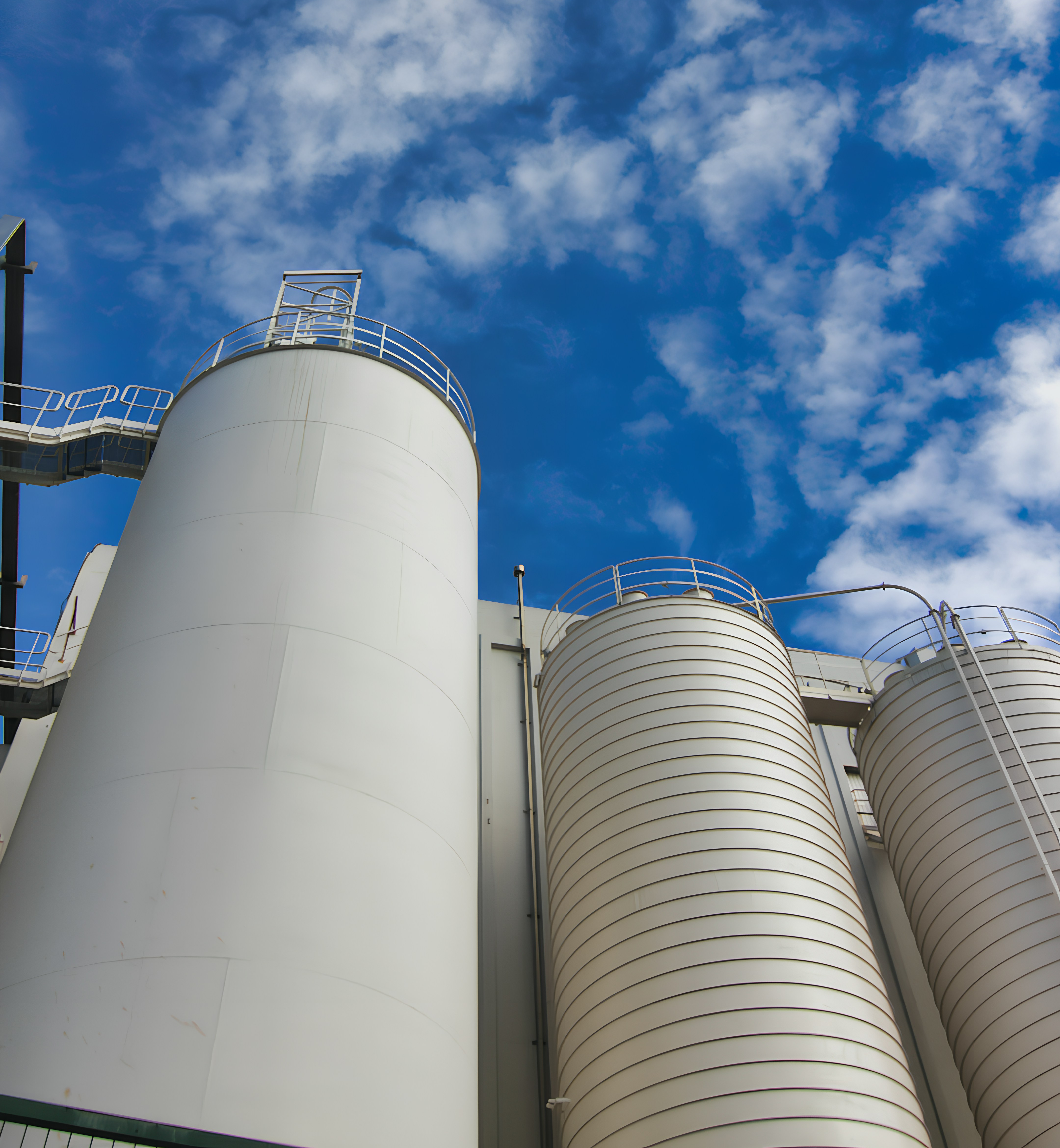 industrial storage tanks against a blue sky